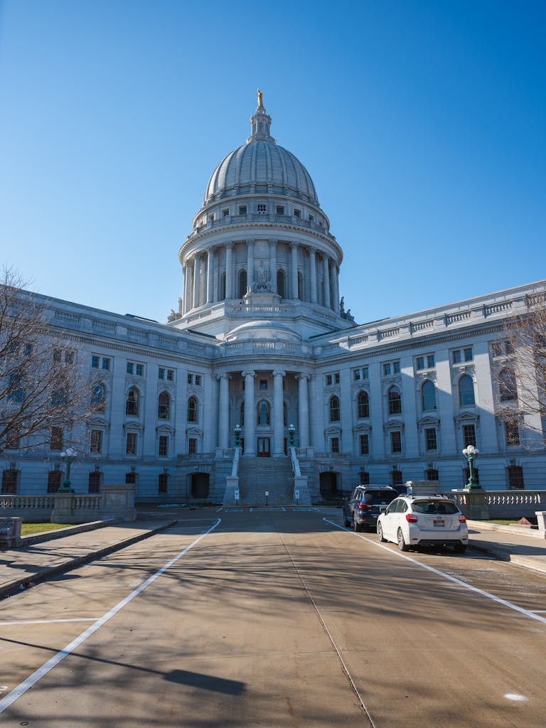 Stunning view of the Wisconsin State Capitol building in Madison under a clear blue sky.